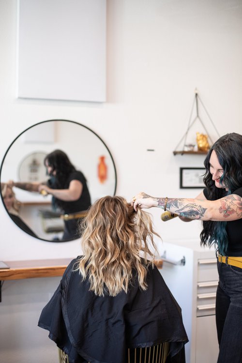 Professional hair styling service at Apika Beauty Studio